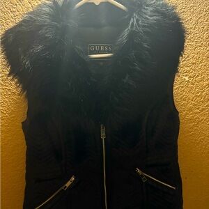Discover the sophistication of a classy faux fur vest by Guess